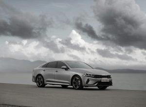 a silver car parked on the side of a road