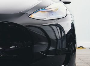 the front end of a black sports car